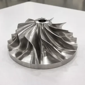 Finished CNC machined metal impeller part with complex curved blades and precision surface finish