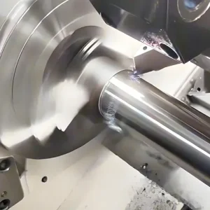 CNC turning machine machining a rotational metal component in a real production environment