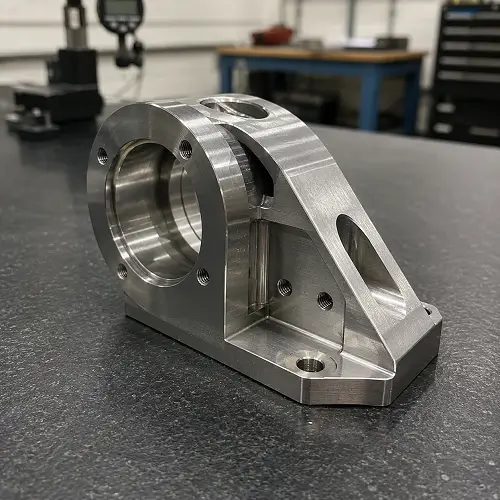 Stainless steel CNC machined part with threaded holes and milled surfaces